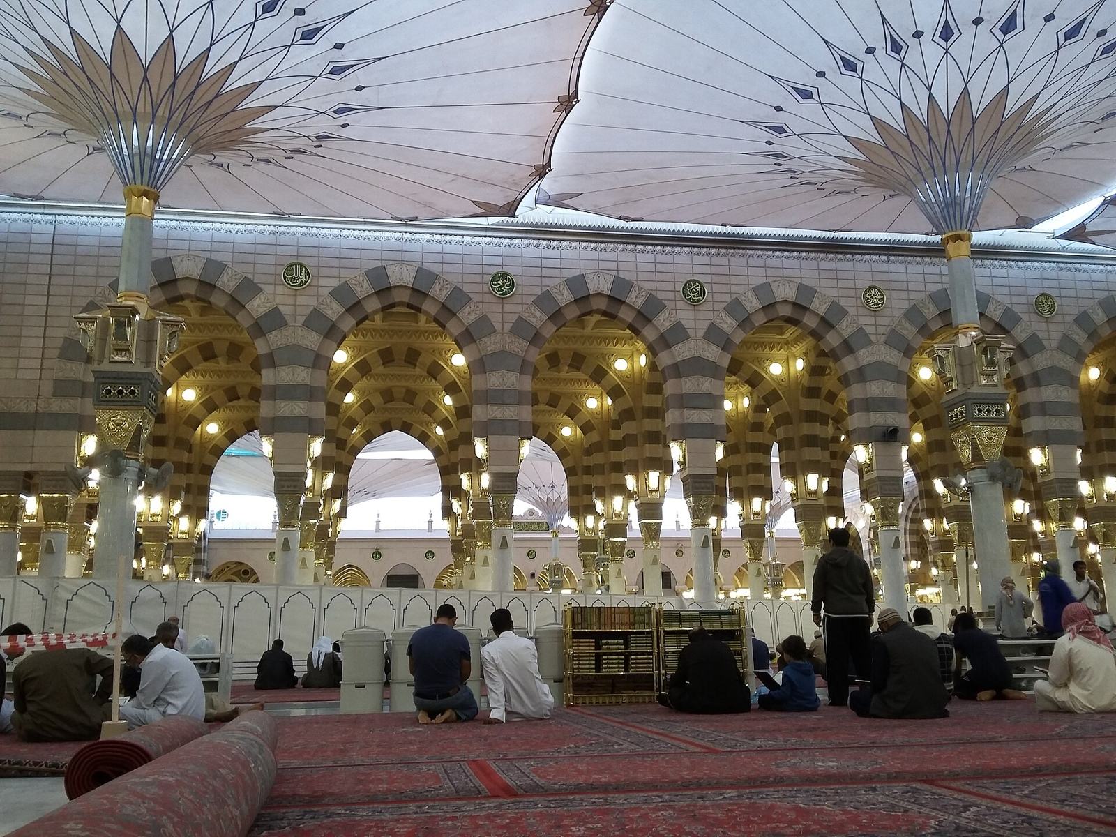 Worshippers in the prayer hall under the arches