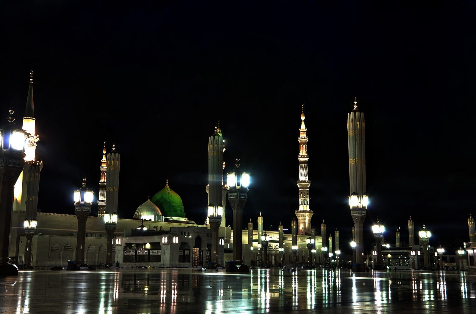 The mosque at night, the Green Dome lit among the minarets